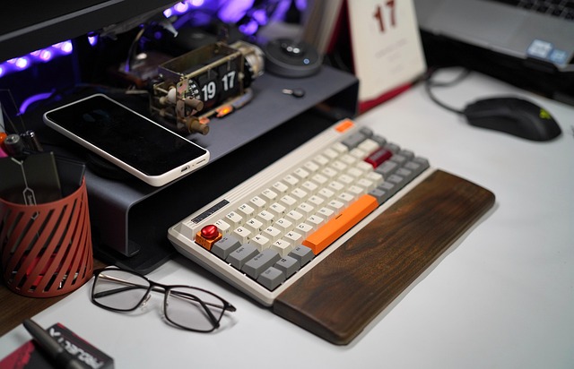 A desk setup featuring a mechanical keyboard and a smartphone