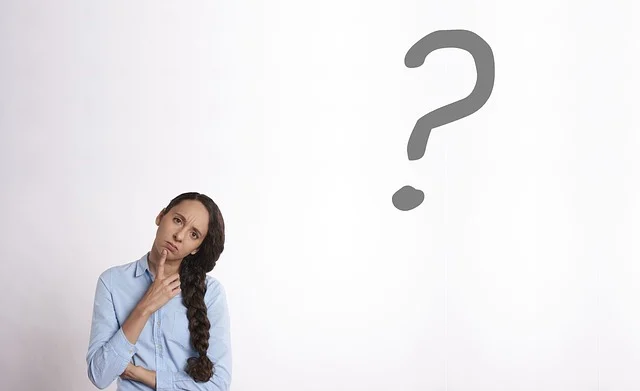 A woman thinking with a question mark, symbolizing common pitfalls and errors.