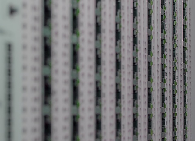 A close-up view of server rack equipment with green indicator lights