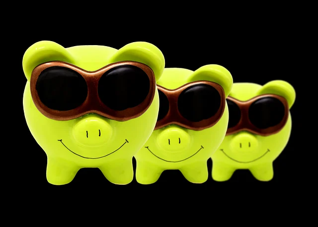 Three green piggy banks wearing sunglasses on a black background