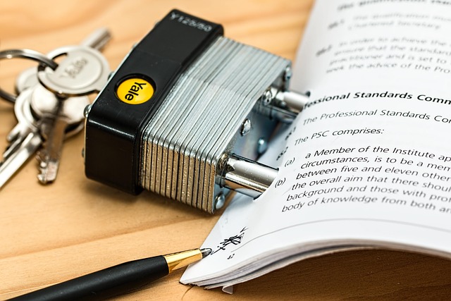 A padlock locking a legal or compliance document next to keys