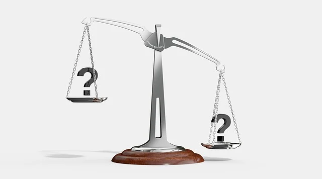 A scale with question marks, symbolizing comparison or uncertainty.