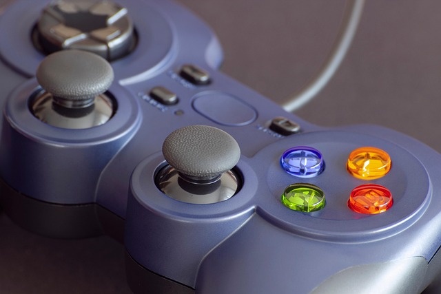 A purple video game controller with colored buttons