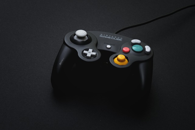 A black Nintendo GameCube controller on a dark surface