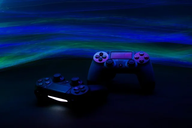 Two game controllers with blue and green light streaks in background