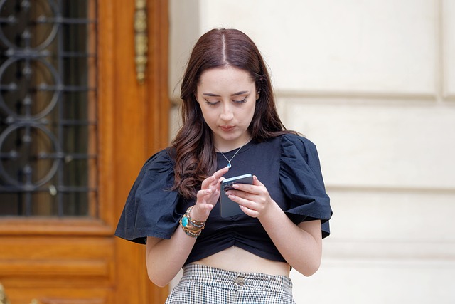 A young woman using her smartphone outdoors