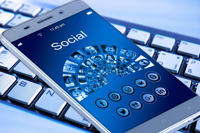 A smartphone displaying a social app interface on a keyboard