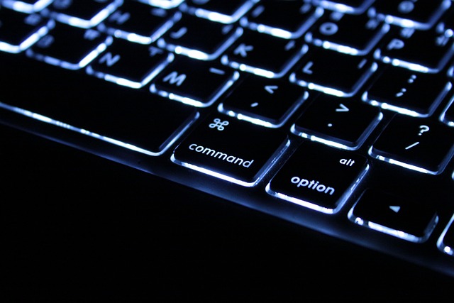 close-up of a MacBook Pro with a clear protective palm rest skin applied