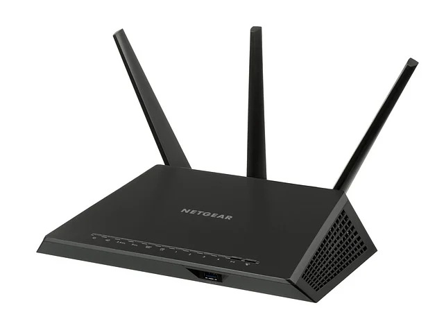 A black Netgear Wi-Fi router with three antennas