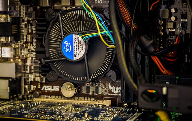 internal components of a high-performance gaming laptop, showing CPU, GPU, RAM, and cooling system (acer vs asus)