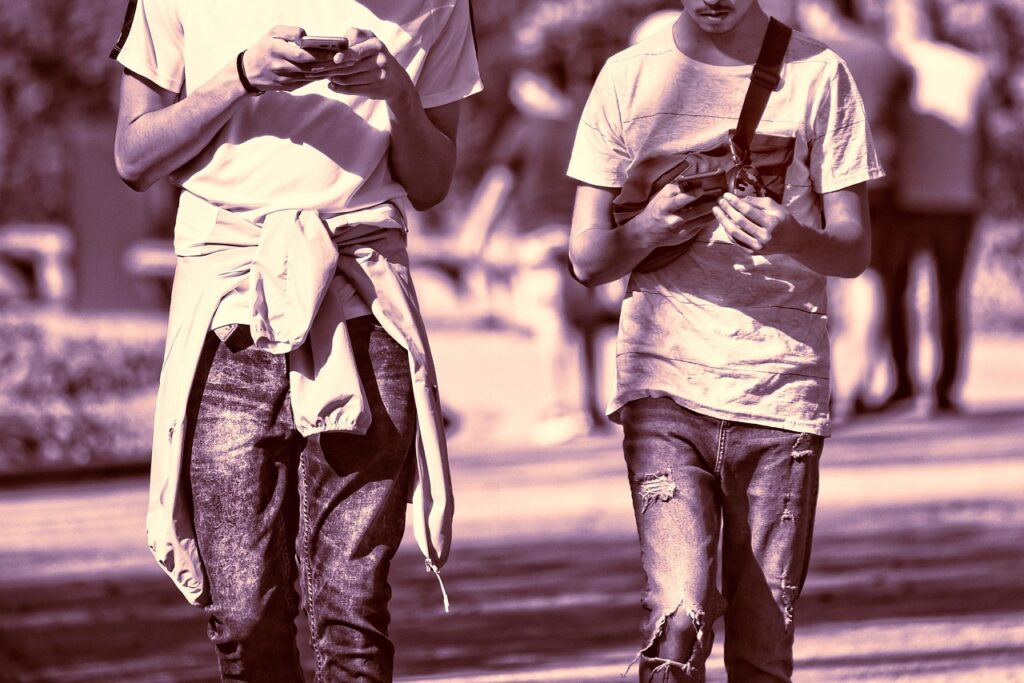 person holding two phones