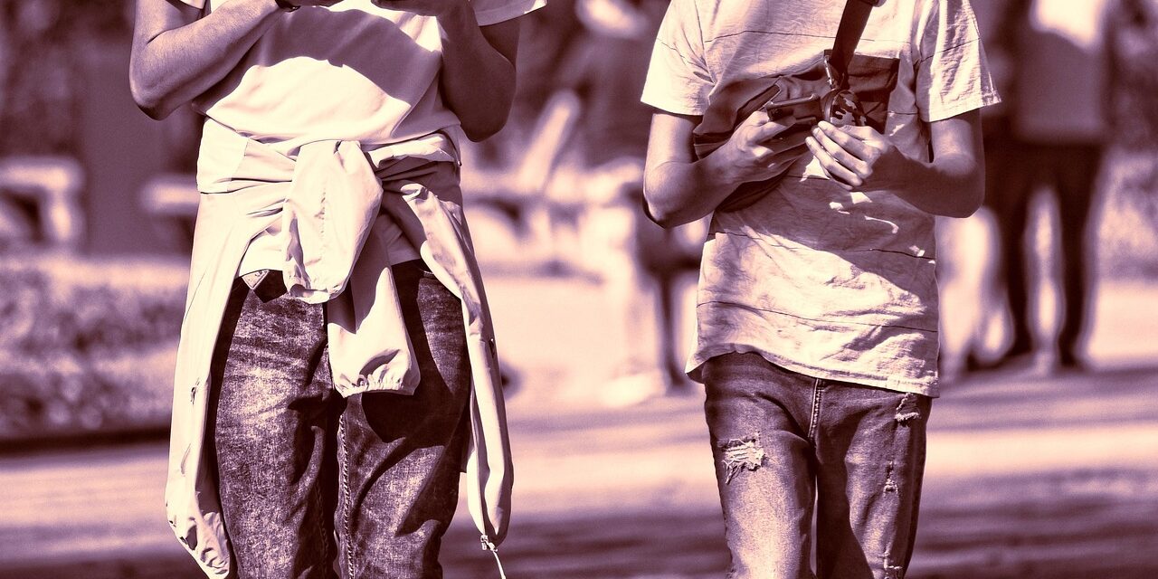 person holding two phones