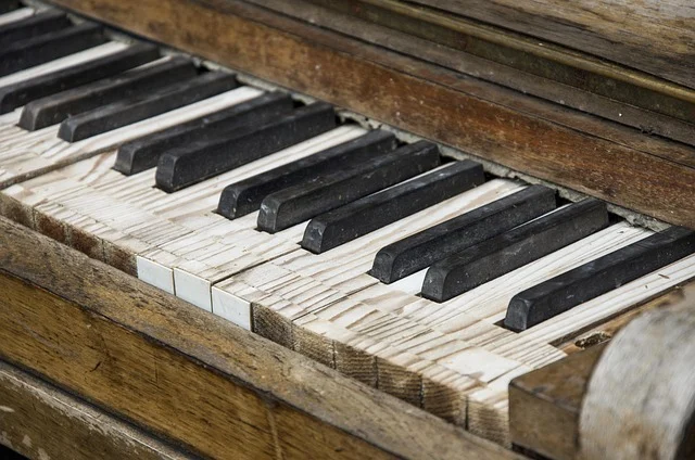 Close-up of old, worn, and damaged piano keys
