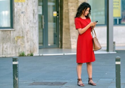 confused person looking at phone