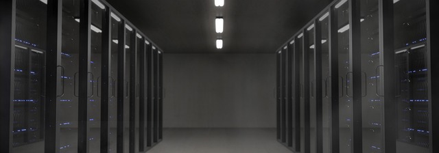 Rows of server racks in a dark server room