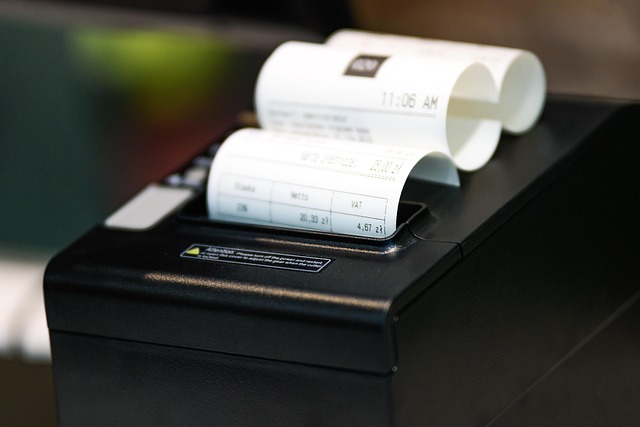 A receipt printer printing out paper receipts