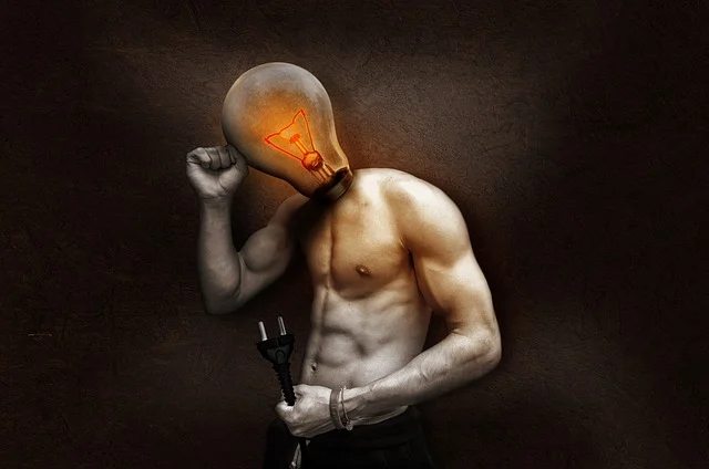 A person with a lightbulb for a head, holding an electrical plug.