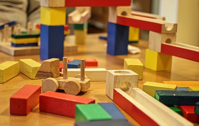 Colorful wooden building blocks and toy tracks on a table