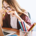 person studying for IT certification with a roadmap