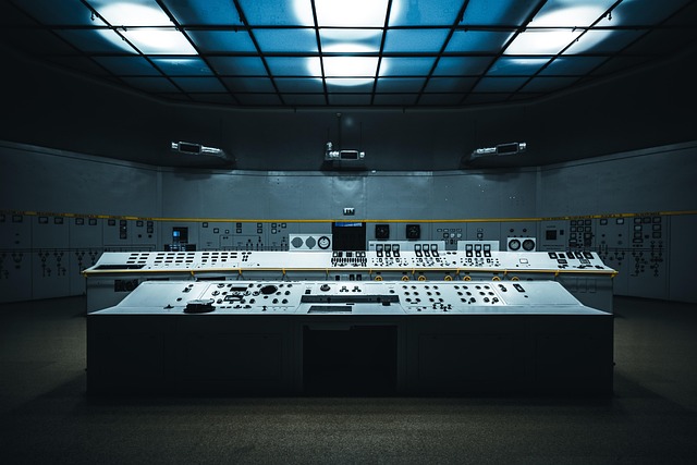 An empty vintage-style technical control room with console panels